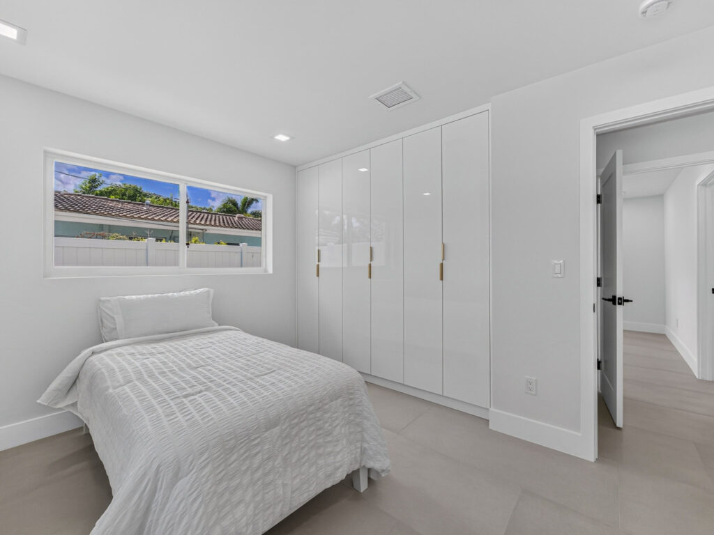 Bedroom with floor-to-ceiling built-in closets