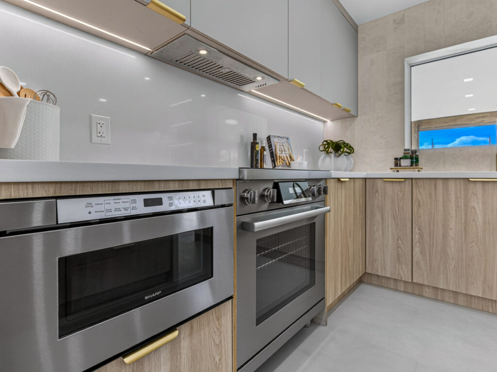 Stainless range, hood and microwave drawer in the kitchen